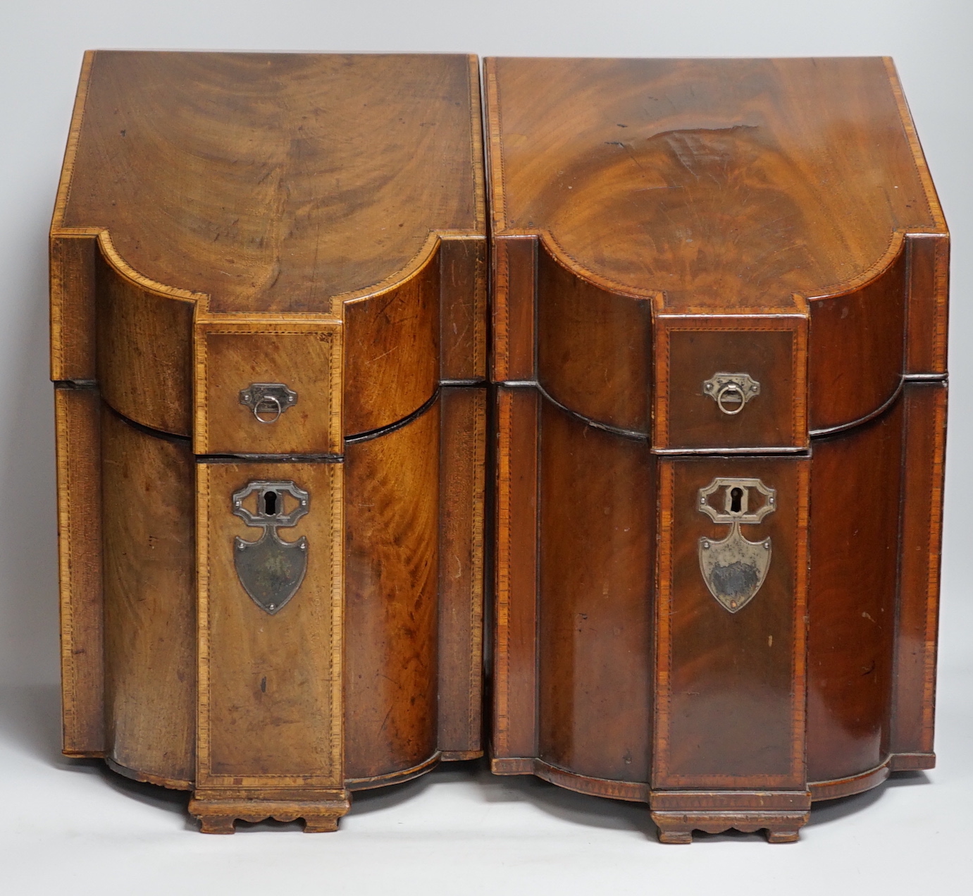 A pair of George III mahogany inlaid knife boxes with shield shaped lock plates (one converted), 38cm high
